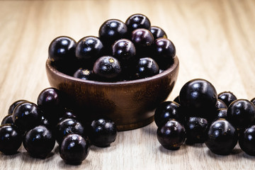 Fruit called Jaboticaba or jabuticaba in a basket on a white background, preserves organic and healthy fruits.