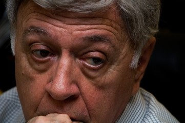 Close up of a old man's eyes looking at something from his left