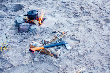 bonfire bowler on the sand on beach at autumn hiking, tourism concept nobody