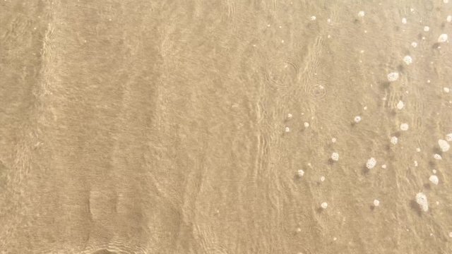 wave and sand on the beach