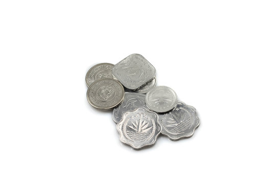 A collection of silver coins from Bangladesh isolated on a white background.  Shot close up in macro
