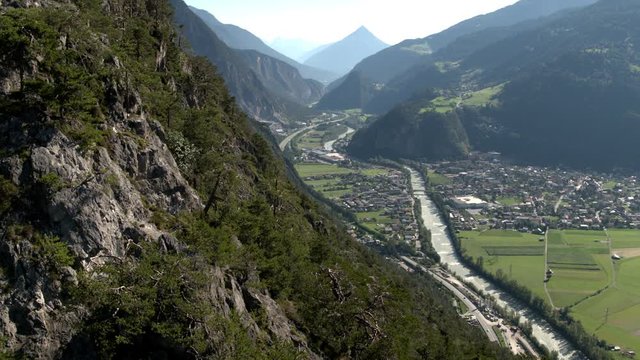 drone view towards alpine city zams and mountain tschirgant