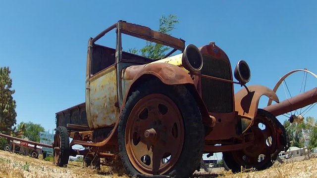Low Angle Rusted Antique Truck In Small Town