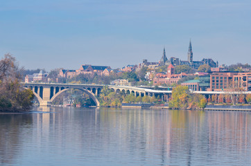Washington D.C. in autumn foliage - Potomac River, Key Bridge and Georgetown in autumn trees.