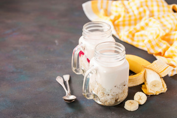 Healthy breakfast - porridge and yogurt in a jar. Selective focus. Copy space