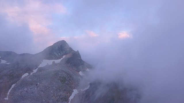 Tete Fenetre summit wrapped in clouds, Grand St Bernard, Switzerland