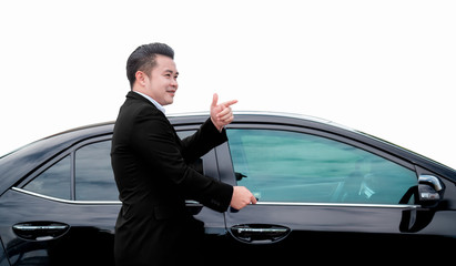 Portrait of handsome Asian businessman in black suit greet with colleagues before leaving by car.
