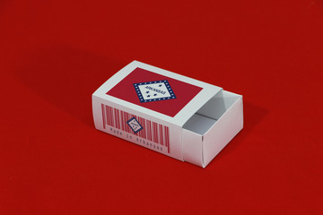 Arkansas flag on white box with barcode and the color of state flag on red background, paper packaging for put match or products.