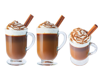 Coffee, cappuccino with whipped cream in a glass, Irish glass. Ground cinnamon, cinnamon stick....