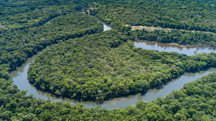 Aerial view of a meandering Amazon tributary river, Amazonian rainforest, San Jose do Rio Claro, Mato Grosso