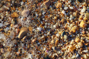 sea pebbles colored granite on the beach