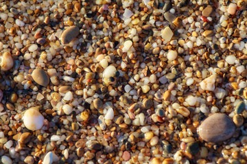 sea pebbles colored granite on the beach