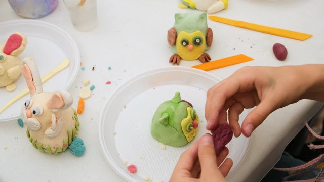 Child playing and creating toys from model clay. Strengthen the imagination of child. owl closeup