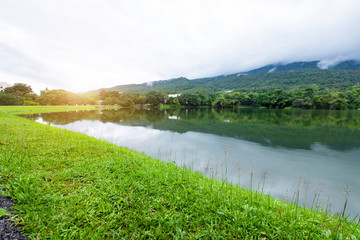 Asphalt black grey road landscape lake views at Ang Kaew Chiang Mai University in nature forest Mountain views spring blue sky background with white cloud.