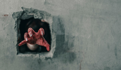 Horror Scene of a Woman with bloody hands in abandoned building, Halloween murder concept.