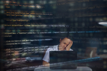 An IT student almost falling asleep at night while writing codes in building a website with random HTML codes surrounding the web designer. Night scenery.  