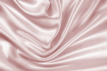 Delicate satin draped fabric pink texture for festive backgrounds