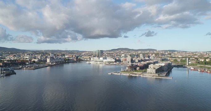 Cinema 4K drone shot with forward motion of the new Bj&oslash;rvika quarter, with the Lambda Munch Museum, Oslo Opera House and S&oslash;renga in clear daylight in autumn fall, in Oslo Norway.