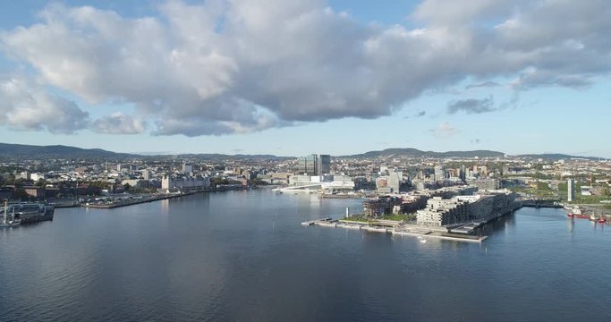 Cinema 4K drone shot with parallax motion of the new Bj&oslash;rvika quarter, with the Lambda Munch Museum, Oslo Opera House and S&oslash;renga in clear daylight in autumn fall, in Oslo Norway.
