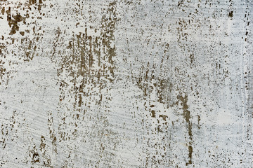 Texture of a concrete wall with cracks and scratches which can be used as a background