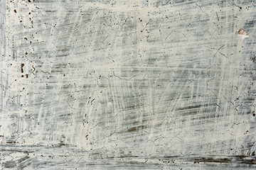 Texture of a concrete wall with cracks and scratches which can be used as a background