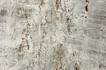 Fototapeta premium Texture of a concrete wall with cracks and scratches which can be used as a background