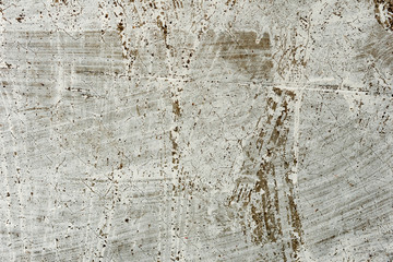 Texture of a concrete wall with cracks and scratches which can be used as a background