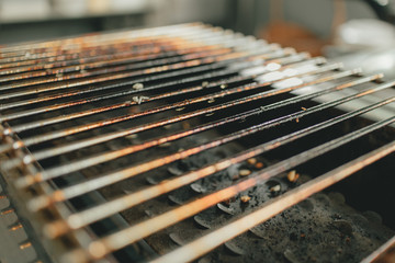 Close up of used burnt grill stove.