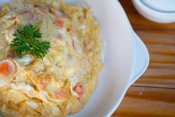 Omelet with steamed rice on top in Thailand style.