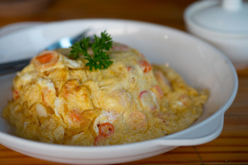 Omelet with steamed rice on top in Thailand style.