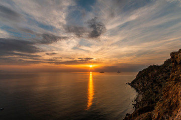 Natural Sunset Sunrise Over Field Or Meadow. Bright Dramatic Sky And Dark Ground. Countryside Landscape Under Scenic Colorful Sky At Sunset Dawn Sunrise. Sun Over Skyline, Horizon. Warm Colours.
