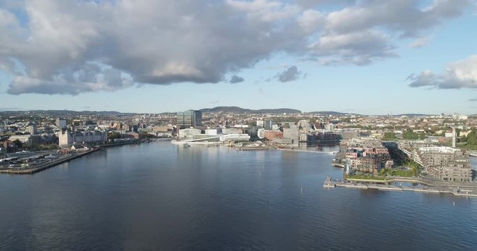 Cinema 4K drone shot with parallax motion of the new Bj&oslash;rvika district, with the Lambda Munch Museum, Opera House and S&oslash;renga in a sunset in autumn fall, in Oslo Norway.