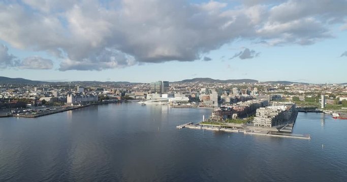 Cinema 4K drone shot with forward motion of the new Bj&oslash;rvika quarter, with the Lambda Munch Museum, Oslo Opera House and S&oslash;renga in clear daylight in autumn fall, in Oslo Norway.