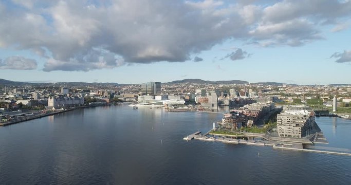 Cinema 4K drone shot with parallax motion of the new Bj&oslash;rvika quarter, with the Lambda Munch Museum, Oslo Opera House and S&oslash;renga in clear daylight in autumn fall, in Oslo Norway.