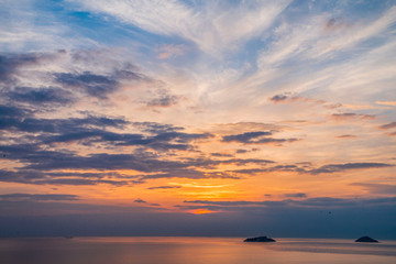 Natural Sunset Sunrise Over Field Or Meadow. Bright Dramatic Sky And Dark Ground. Countryside Landscape Under Scenic Colorful Sky At Sunset Dawn Sunrise. Sun Over Skyline, Horizon. Warm Colours.