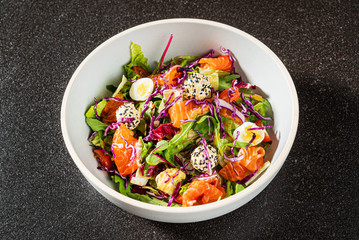 salad with salmon and quail eggs