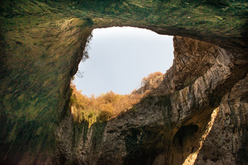 View inside the Devetashka Cave near Devetaki village and Osam river in Lovech, Bulgaria. Natural wonder. One of the largest karst cave in Eastern Europe, now home to near 30000 bats