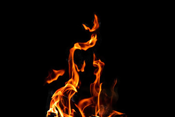 Fire, flames on a black background isolate. Concept fire grill heat weekend barbecue.