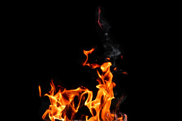 Fototapeta na wymiar Fire, flames on a black background isolate. Concept fire grill heat weekend barbecue.
