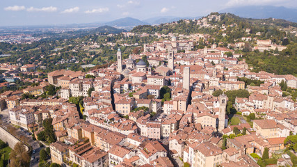Obraz premium Bergamo, Italy. Amazing drone aerial view of the old town. Landscape at the city center, Its historical buildings and the towers