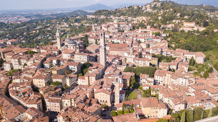 Obraz premium Bergamo, Italy. Amazing drone aerial view of the old town. Landscape at the city center, Its historical buildings and the towers