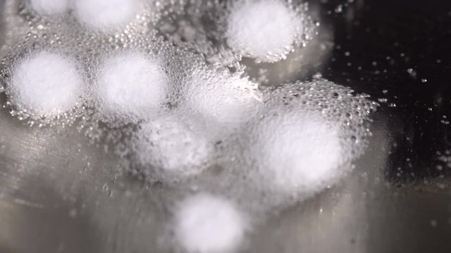 From the tablets, drugs are boiled in a spoon over a gas burner