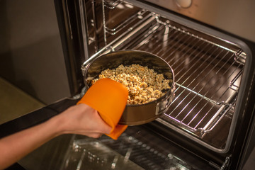 baking tray with granola in the oven