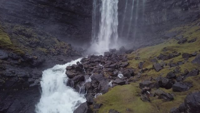 Man observing the Fossa waterfall, Streymoy island, Faroe Islands, Denmark
