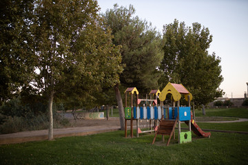 Green area with children's playground with slides