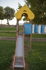 Green area with children's playground with slides