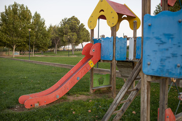 Green area with children's playground with slides