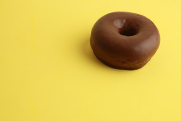 chocolate bagel on colorful background