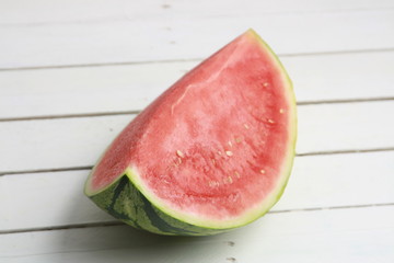 cut watermelon on wooden background