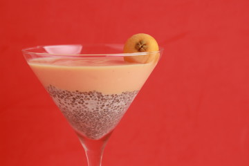 glass with chia and medlars pudding